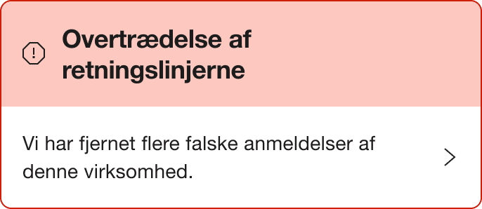 A Red warning alert banner that says "Breach of guidelines. We've removed a number of fake reviews for this company."